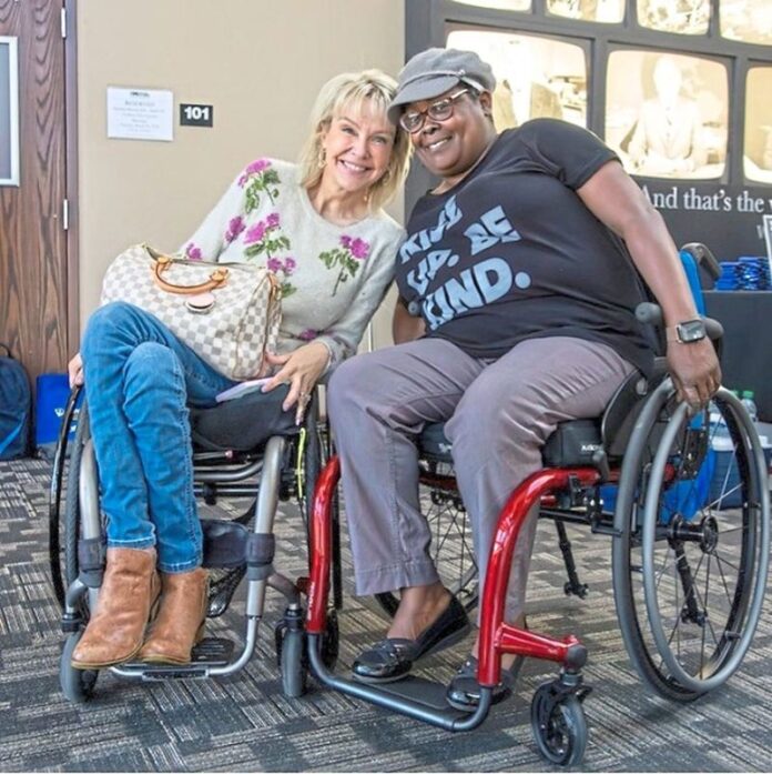 Two women in wheelchairs.