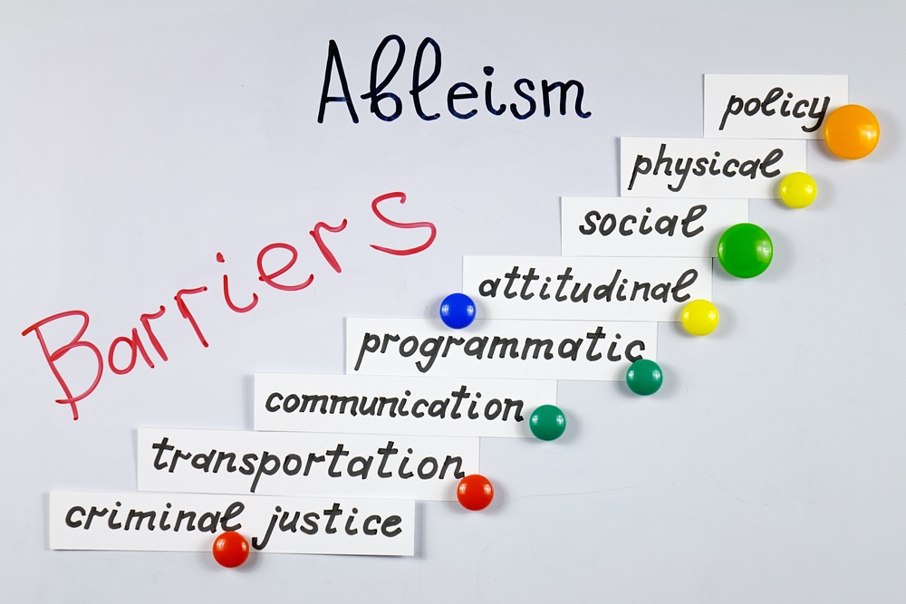 Presentation about ableism and kinds of barriers for persons with disabilities with using a white magnetic board